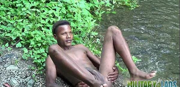  Brown soldier strips naked by the stream